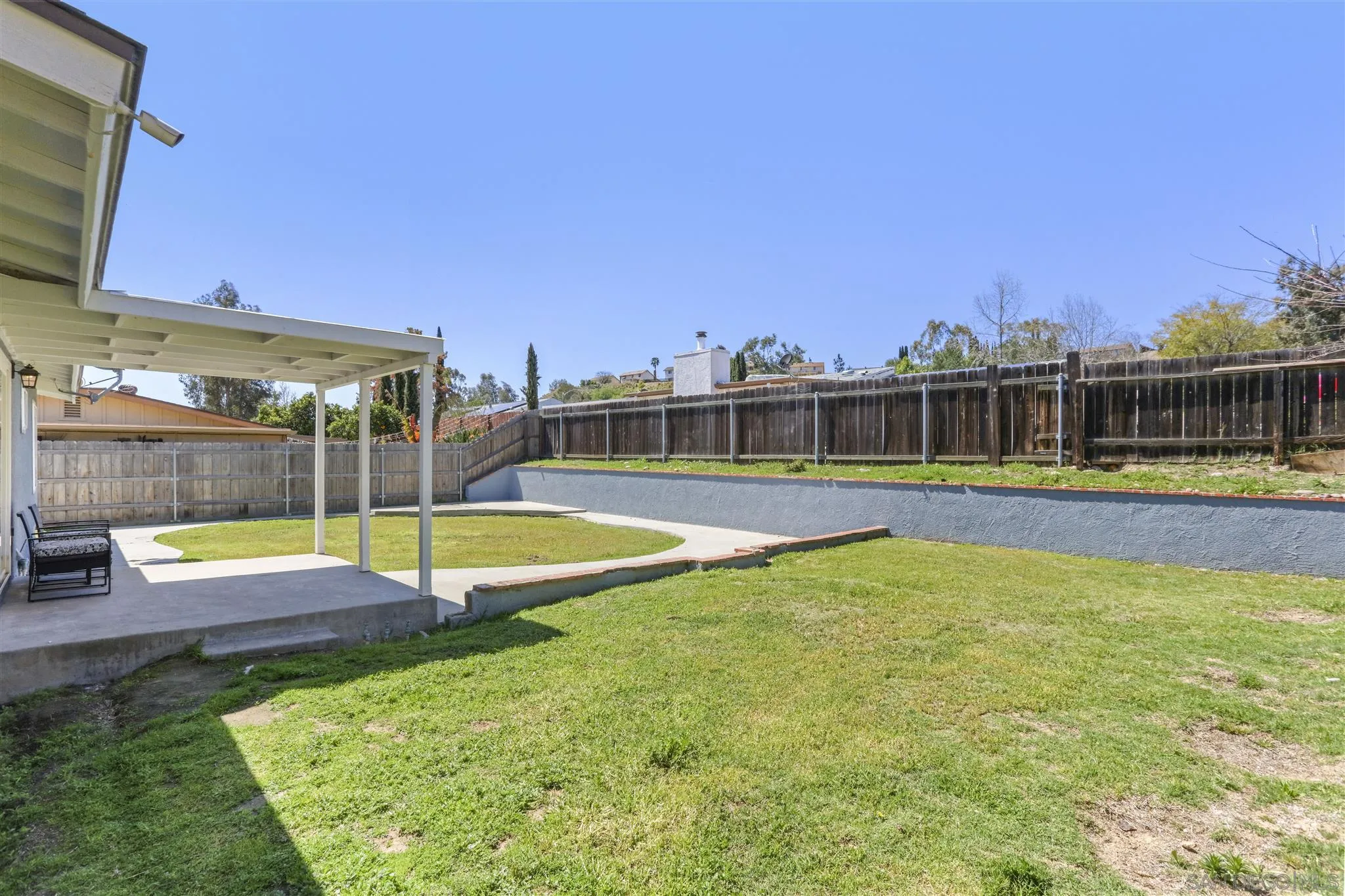 13726 Utopia Road Poway, CA 92064 - Photo 17 of 19 a view of a swimming pool with an outdoor seating and a yard