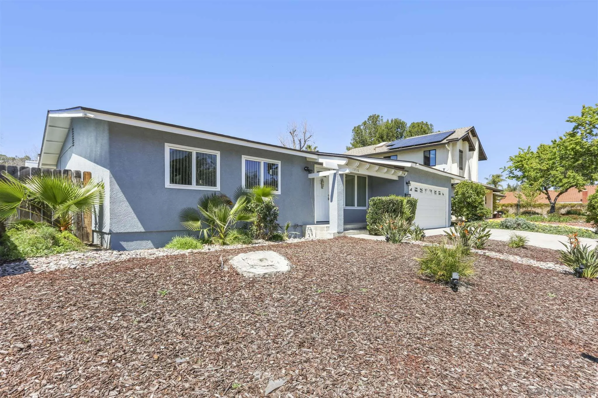 13726 Utopia Road Poway, CA 92064 - Photo 2 of 19 a front view of a house with a yard and porch
