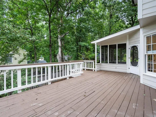 a view of deck with wooden floor and fence