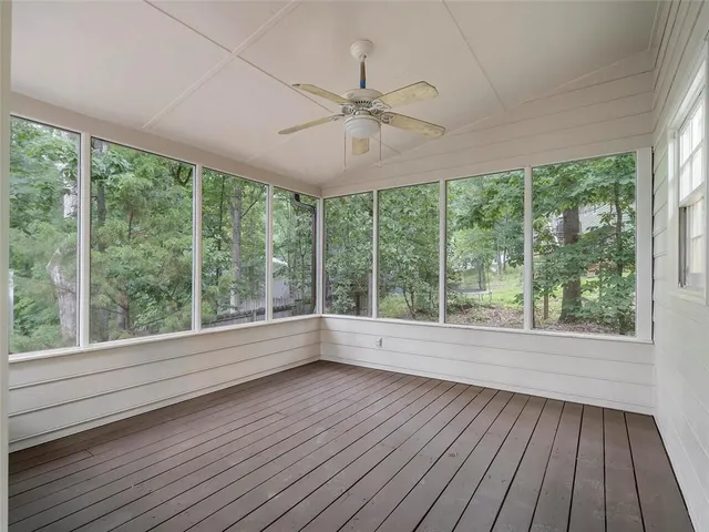 a view of wooden floor cabinets kitchen in a room
