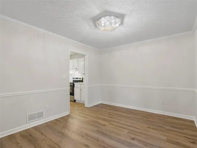 a view of a livingroom with wooden floor