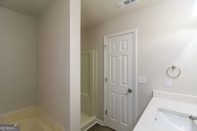 a view of a bathroom from the hallway
