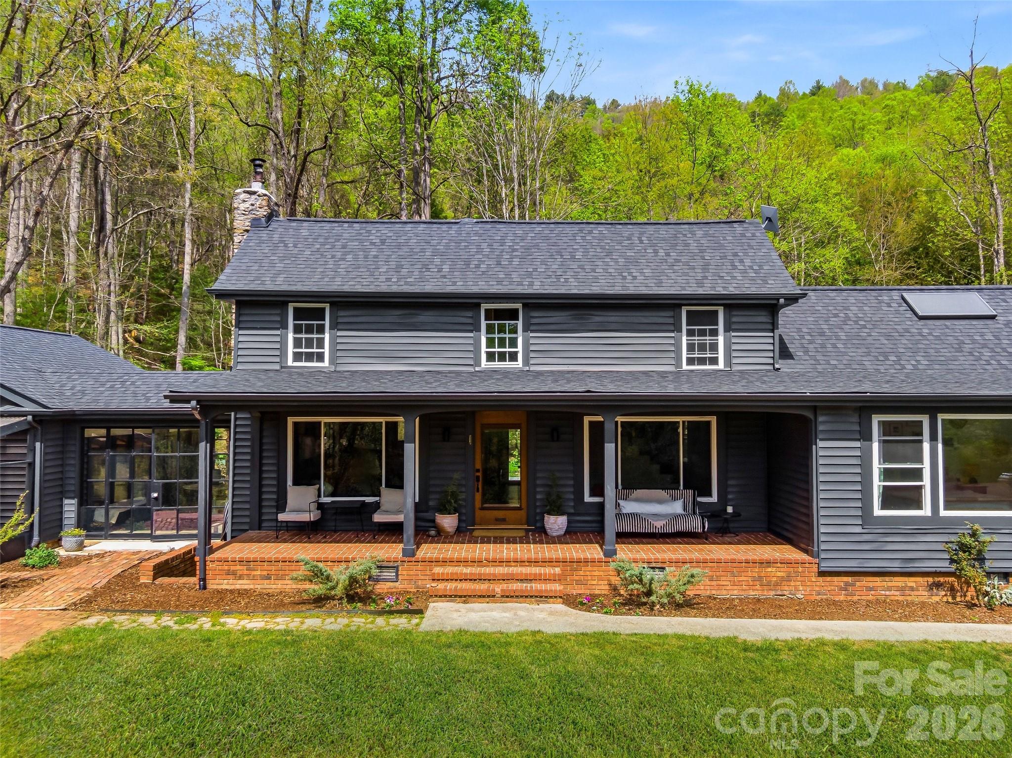 51 Mark Twain Road Asheville, NC 28805 - Photo 2 of 46 front view of a house with a yard
