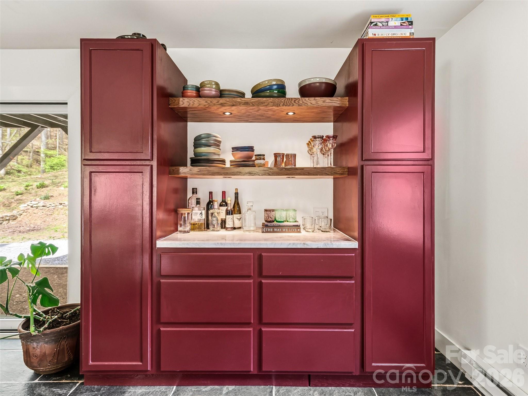 51 Mark Twain Road Asheville, NC 28805 - Photo 21 of 46 a kitchen with a refrigerator and potted plant