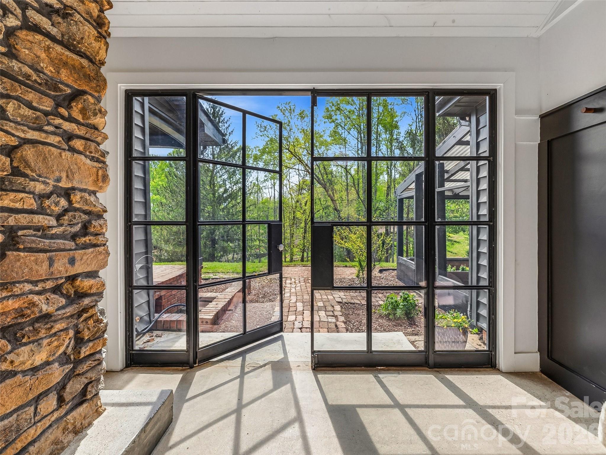 51 Mark Twain Road Asheville, NC 28805 - Photo 25 of 46 a view of a garden from a living room