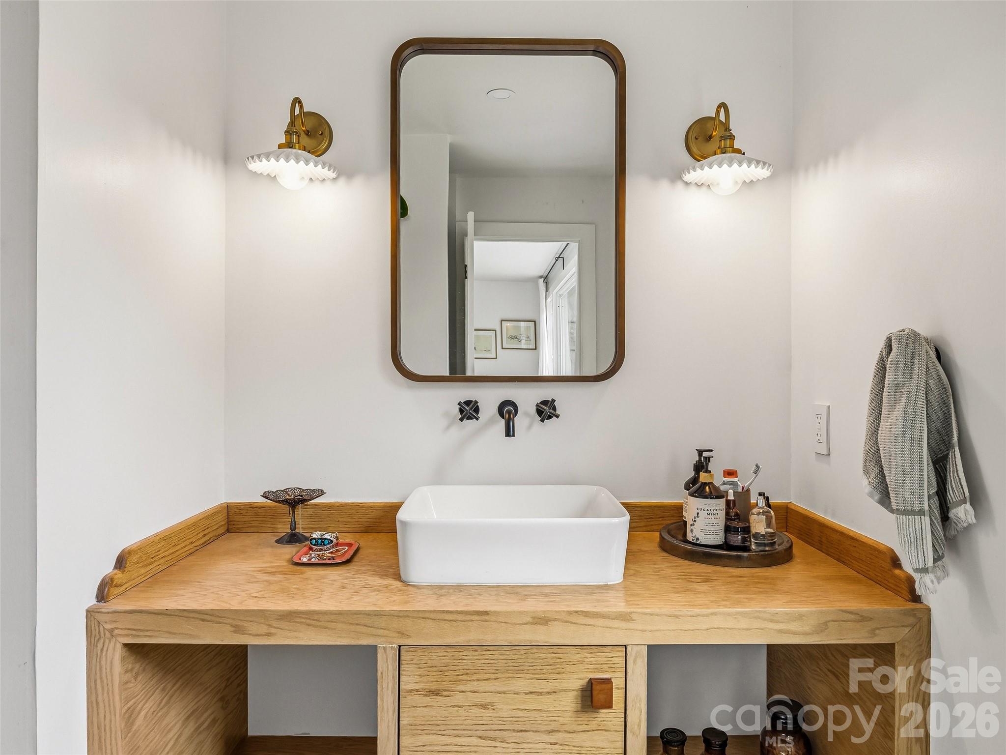 51 Mark Twain Road Asheville, NC 28805 - Photo 30 of 46 a bathroom with a sink and a mirror
