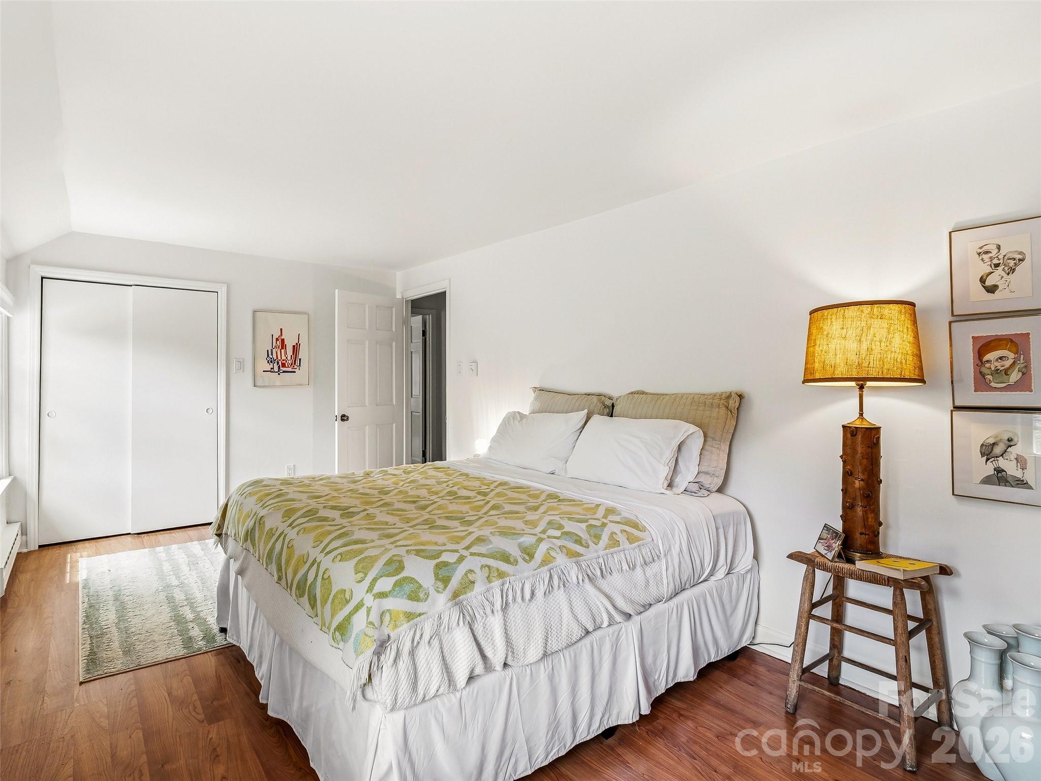 51 Mark Twain Road Asheville, NC 28805 - Photo 36 of 46 a bedroom with a bed and painting on the wall