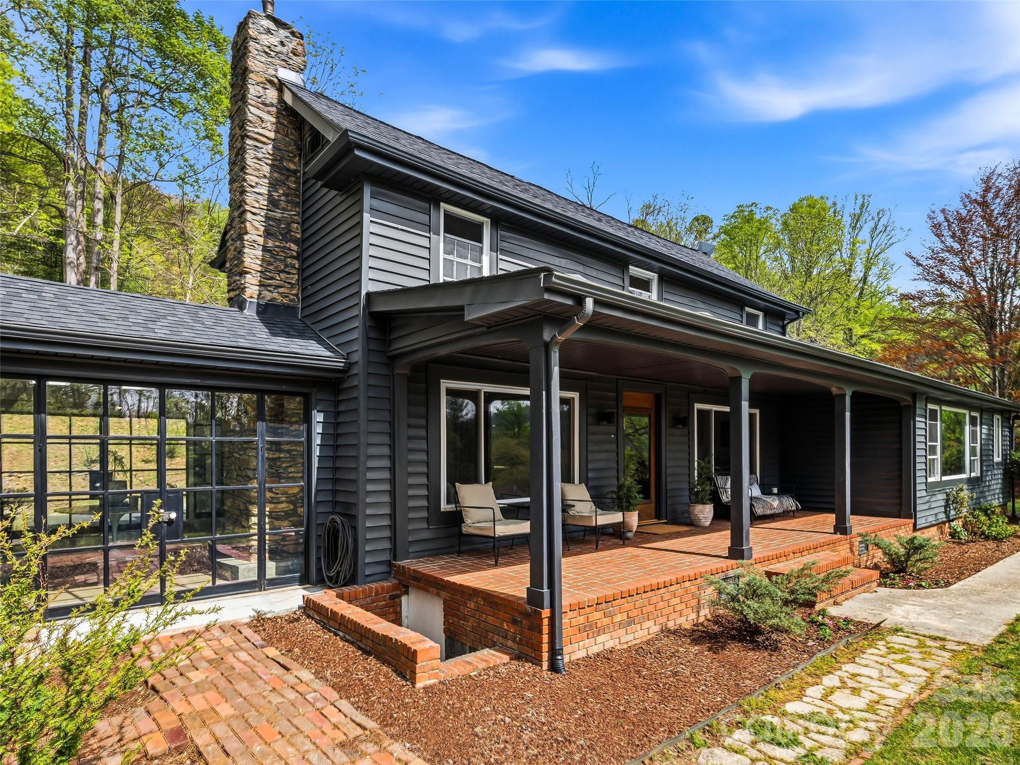 51 Mark Twain Road Asheville, NC 28805 - Photo 5 of 46 a view of a house with a patio