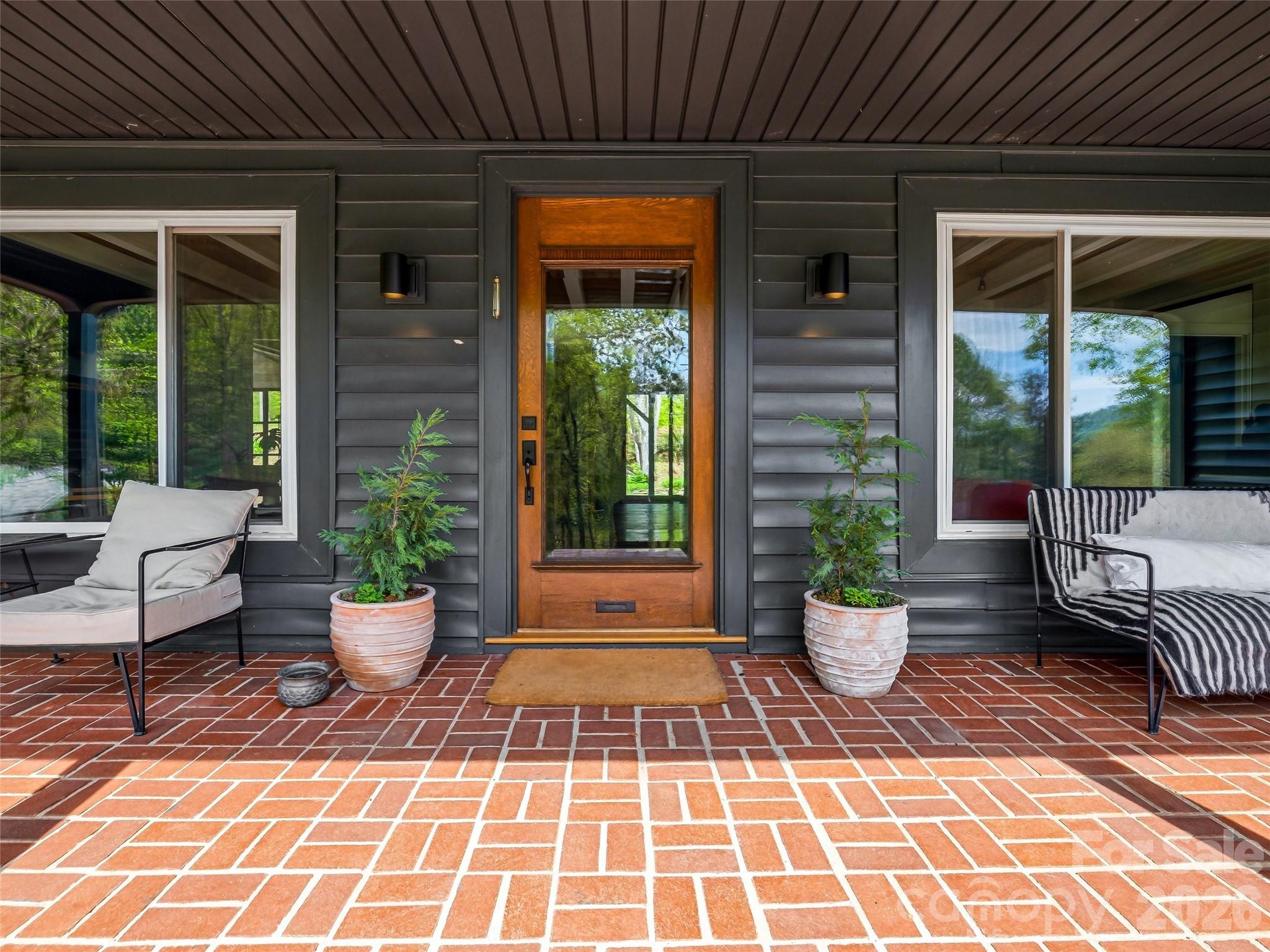 51 Mark Twain Road Asheville, NC 28805 - Photo 6 of 46 a view of a patio with chairs and plants