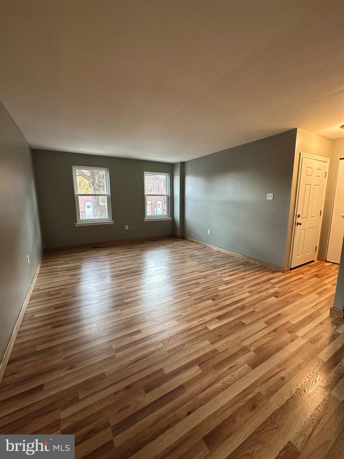 12077 Abby Road Philadelphia, PA 19154 - Photo 14 of 27 a view of empty room with window and wooden floor