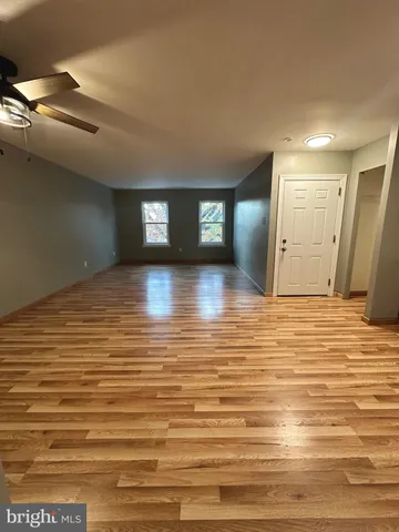 a view of a livingroom with wooden floor