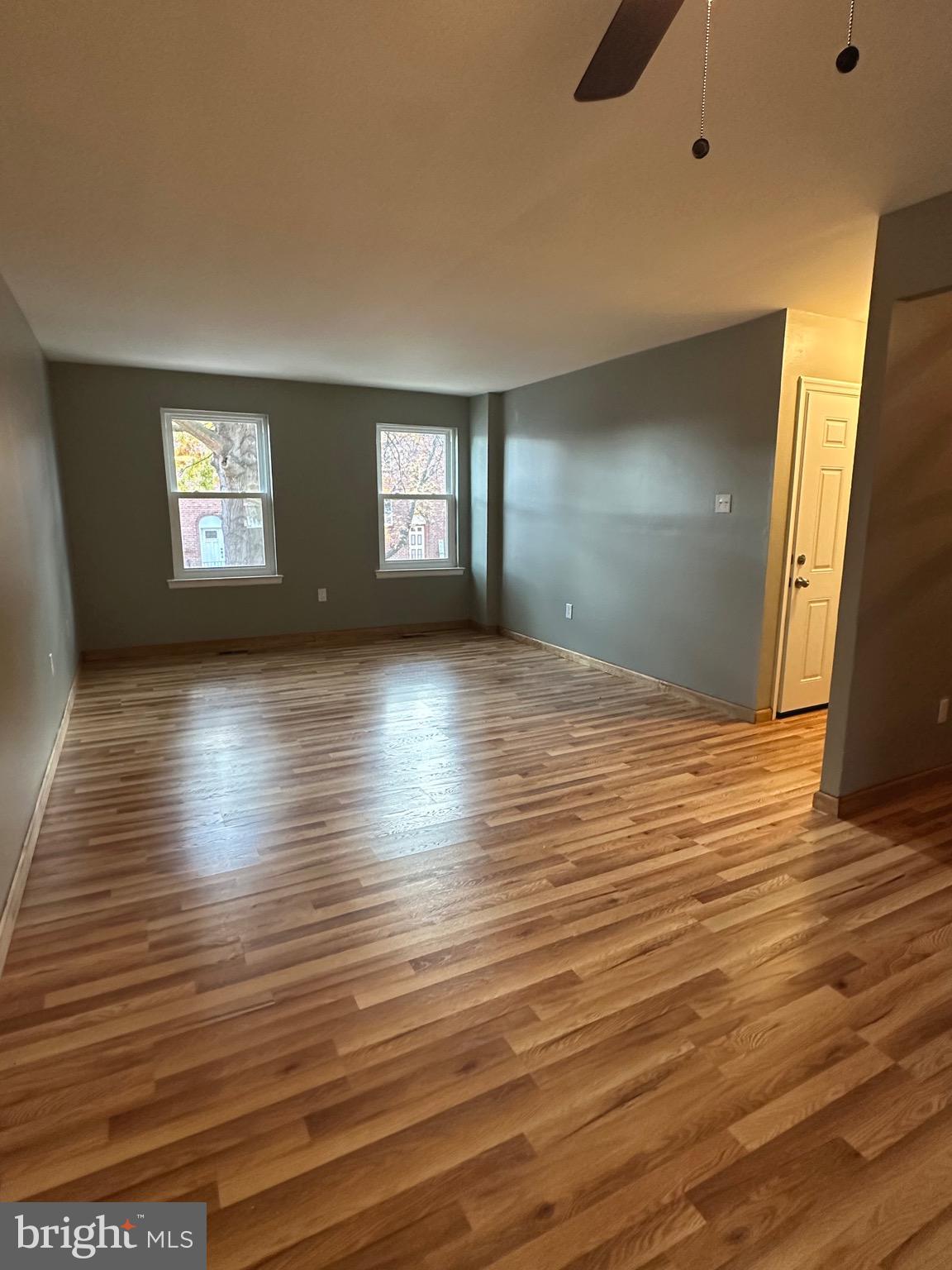 12077 Abby Road Philadelphia, PA 19154 - Photo 9 of 27 a view of an empty room with window and wooden floor
