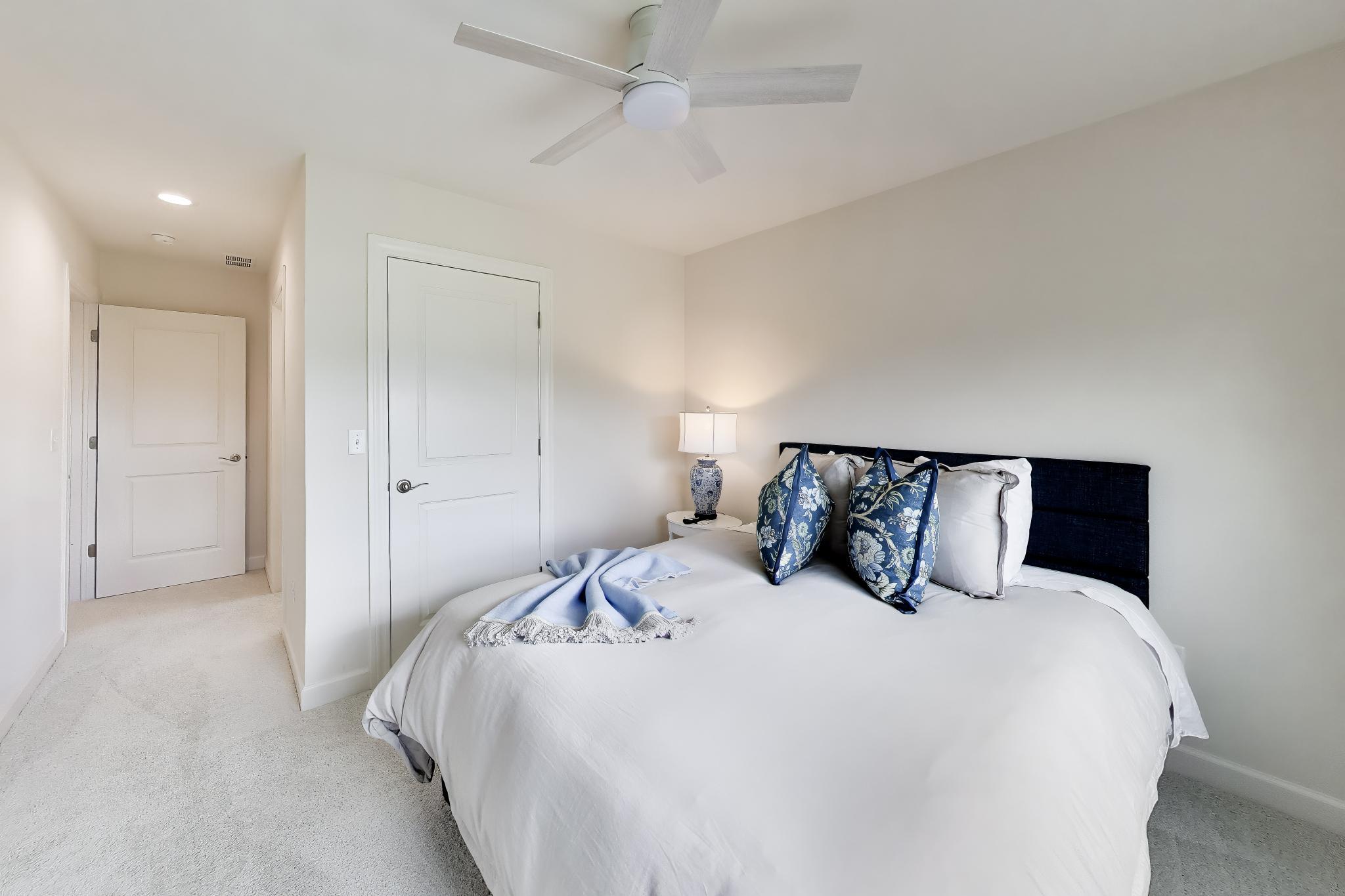 2730 Harbor Court Delavan, WI 53115 - Photo 28 of 47 Upper-level bedroom with ceiling fan, closet access, and nearby hallway connection.