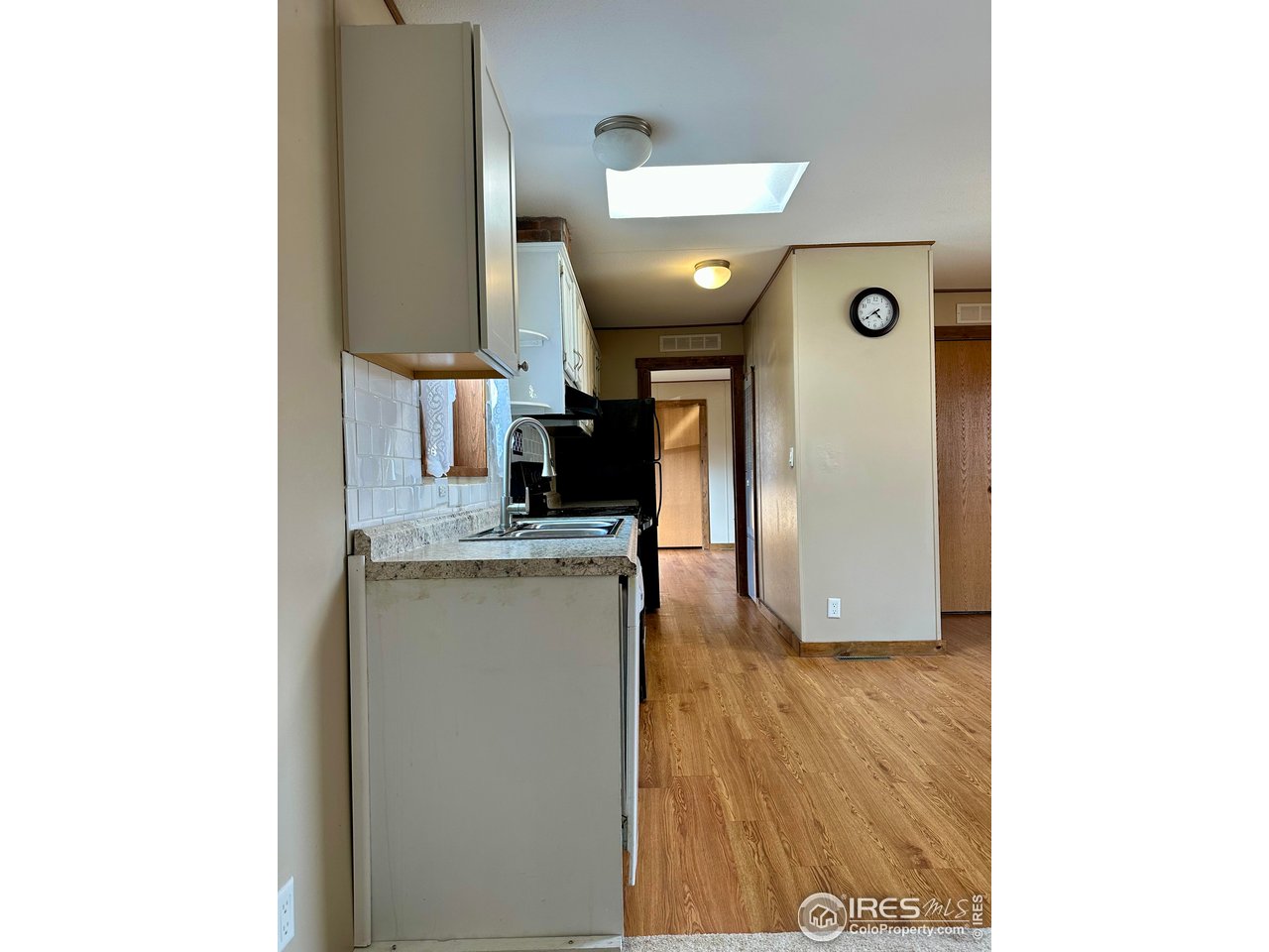 230 North 2nd Street, Unit 83 Berthoud, CO 80513 - Photo 19 of 50 From Hall to Kitchen