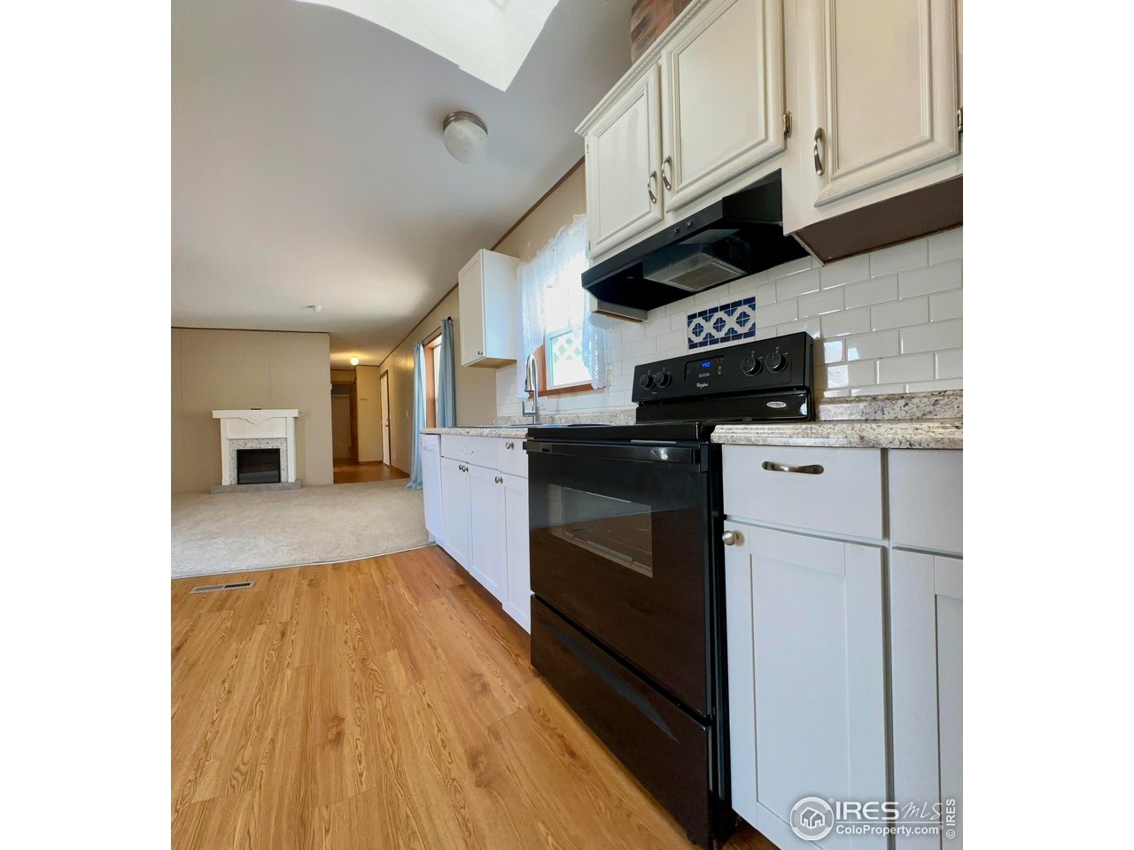 230 North 2nd Street, Unit 83 Berthoud, CO 80513 - Photo 28 of 50 Kitchen looking back