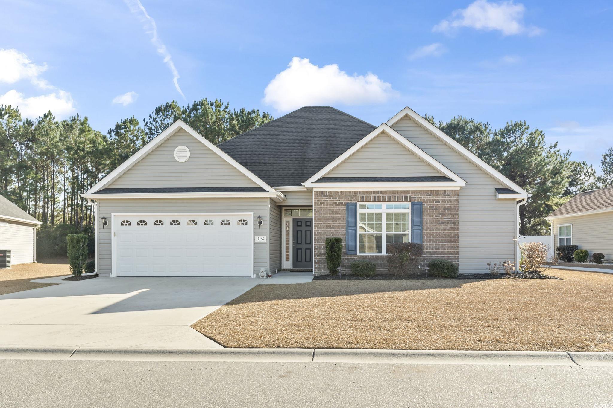 308 Turning Pines Loop Myrtle Beach, SC 29579 - Photo 1 of 33 View of front facade with a garage