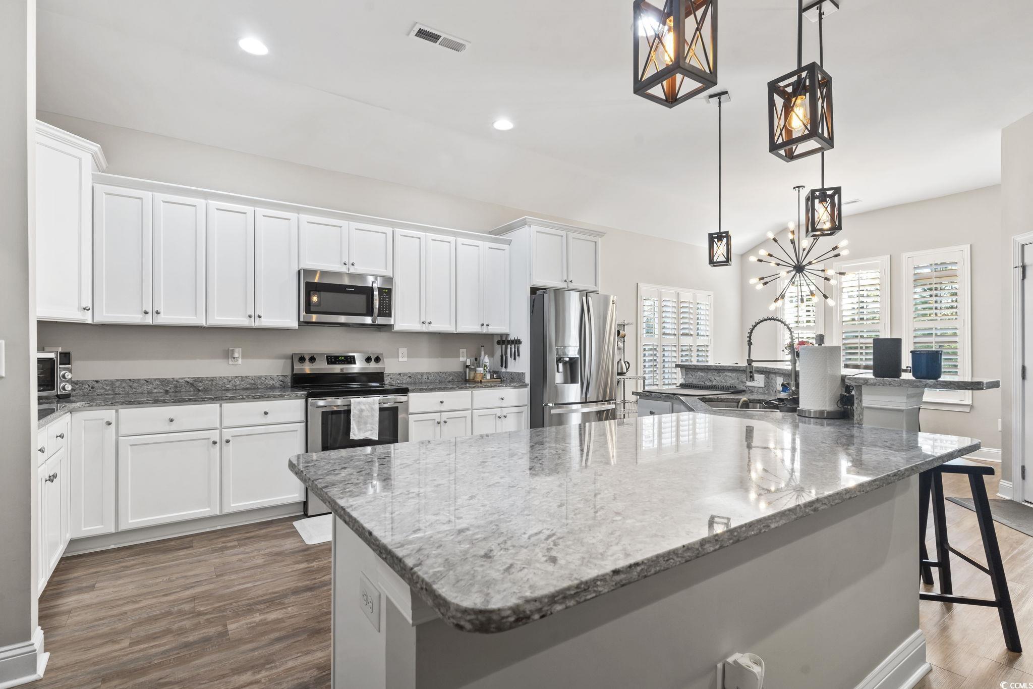 308 Turning Pines Loop Myrtle Beach, SC 29579 - Photo 12 of 33 Kitchen with a breakfast bar, a large island with
