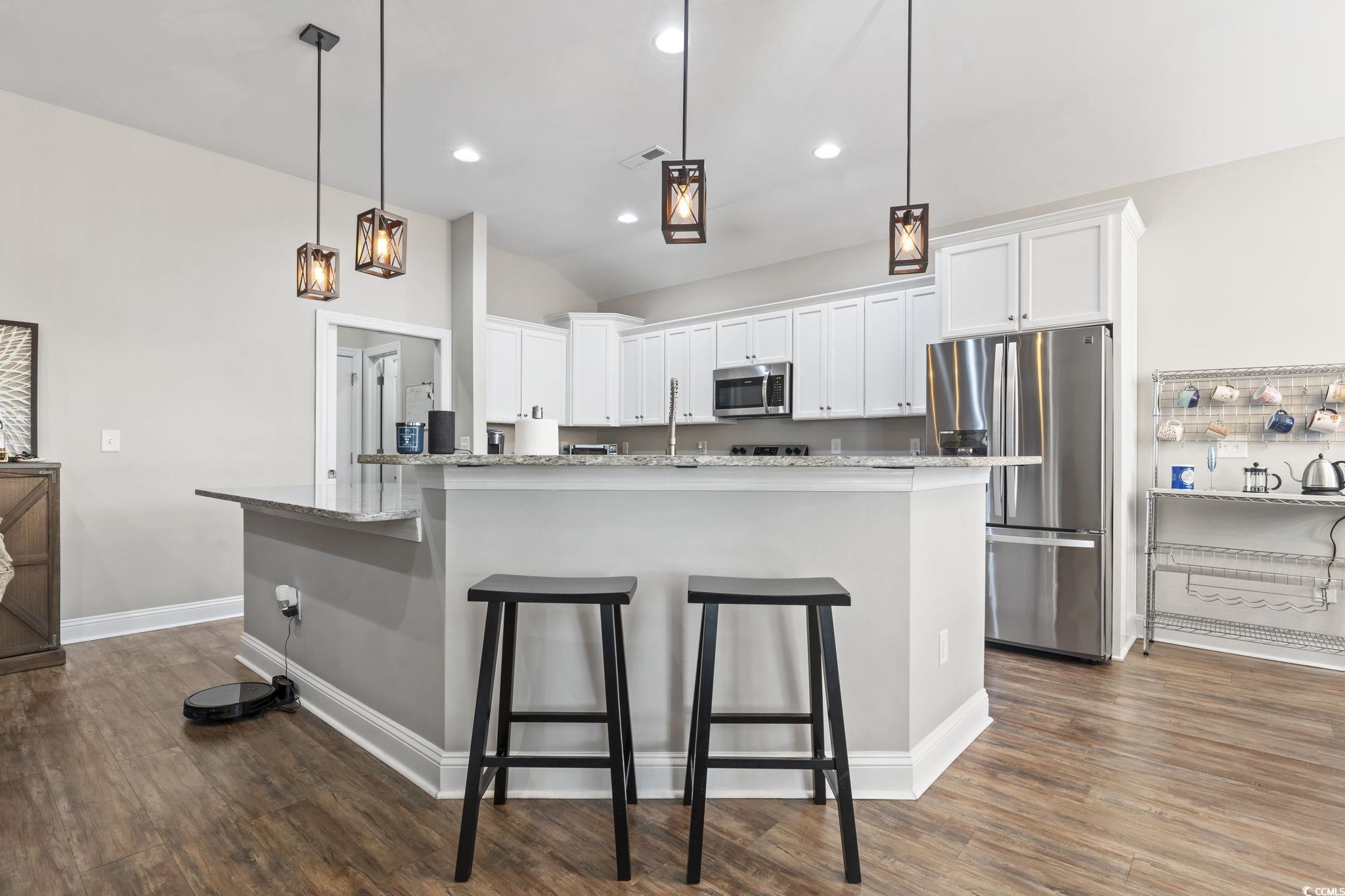 308 Turning Pines Loop Myrtle Beach, SC 29579 - Photo 13 of 33 Kitchen with decorative light fixtures, white cabi