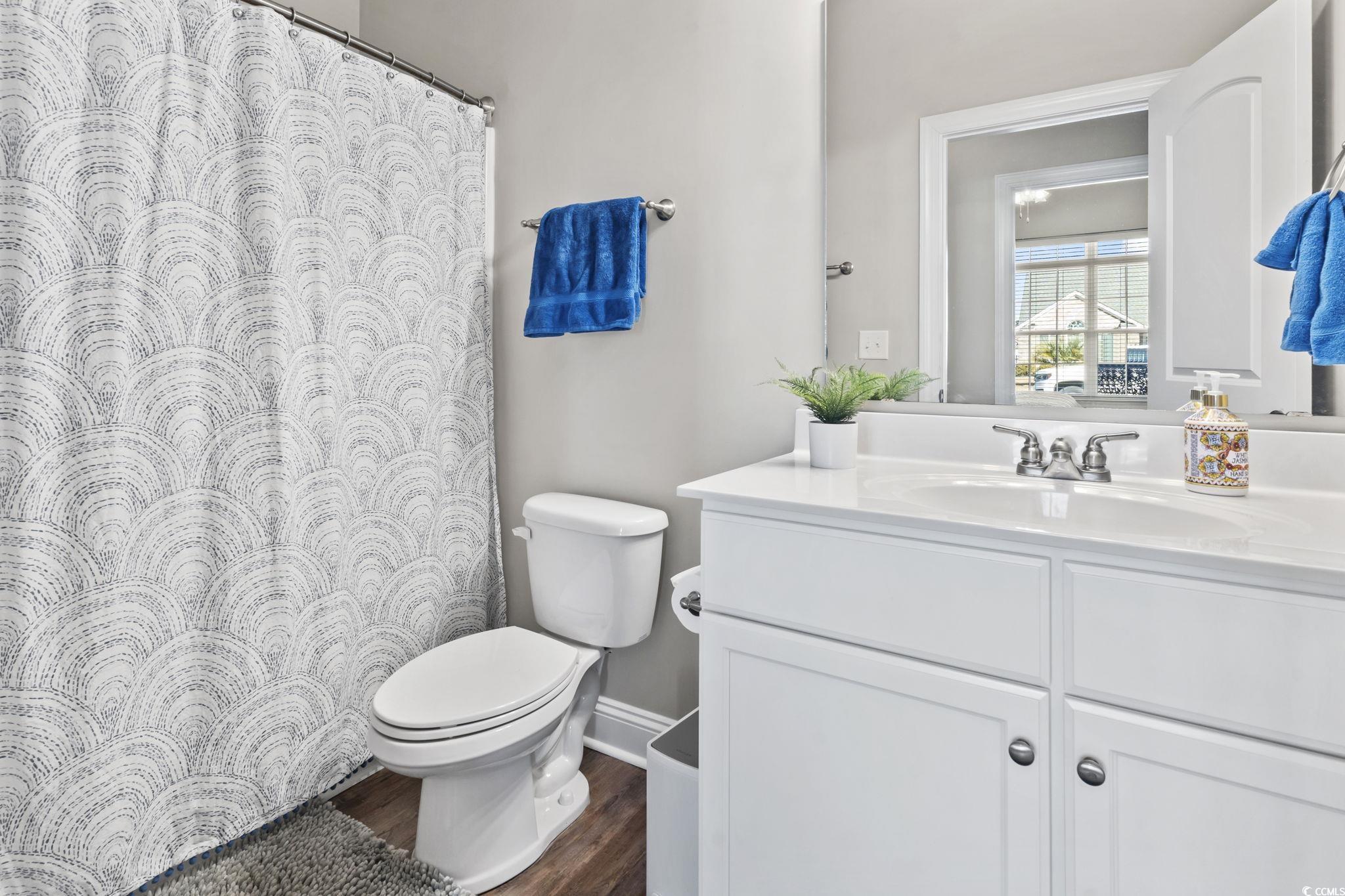 308 Turning Pines Loop Myrtle Beach, SC 29579 - Photo 24 of 33 Bathroom featuring hardwood / wood-style floors, t