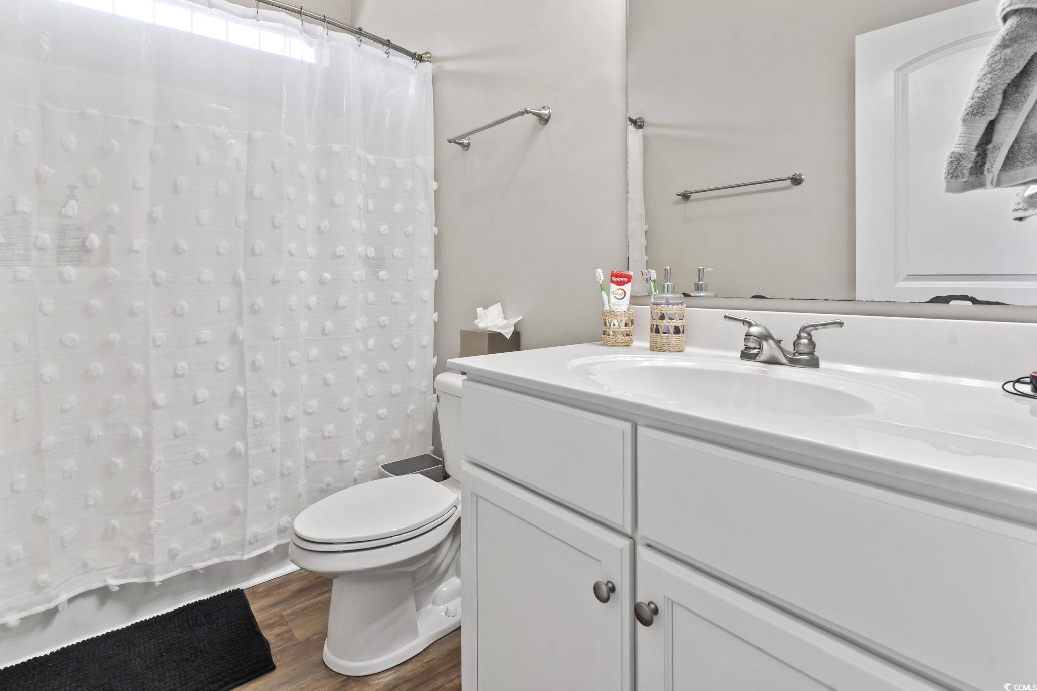 308 Turning Pines Loop Myrtle Beach, SC 29579 - Photo 27 of 33 Bathroom with hardwood / wood-style floors, toilet