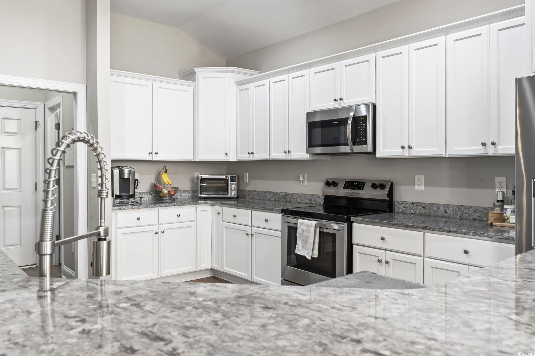 308 Turning Pines Loop Myrtle Beach, SC 29579 - Photo 3 of 33 Kitchen featuring white cabinetry, stainless steel