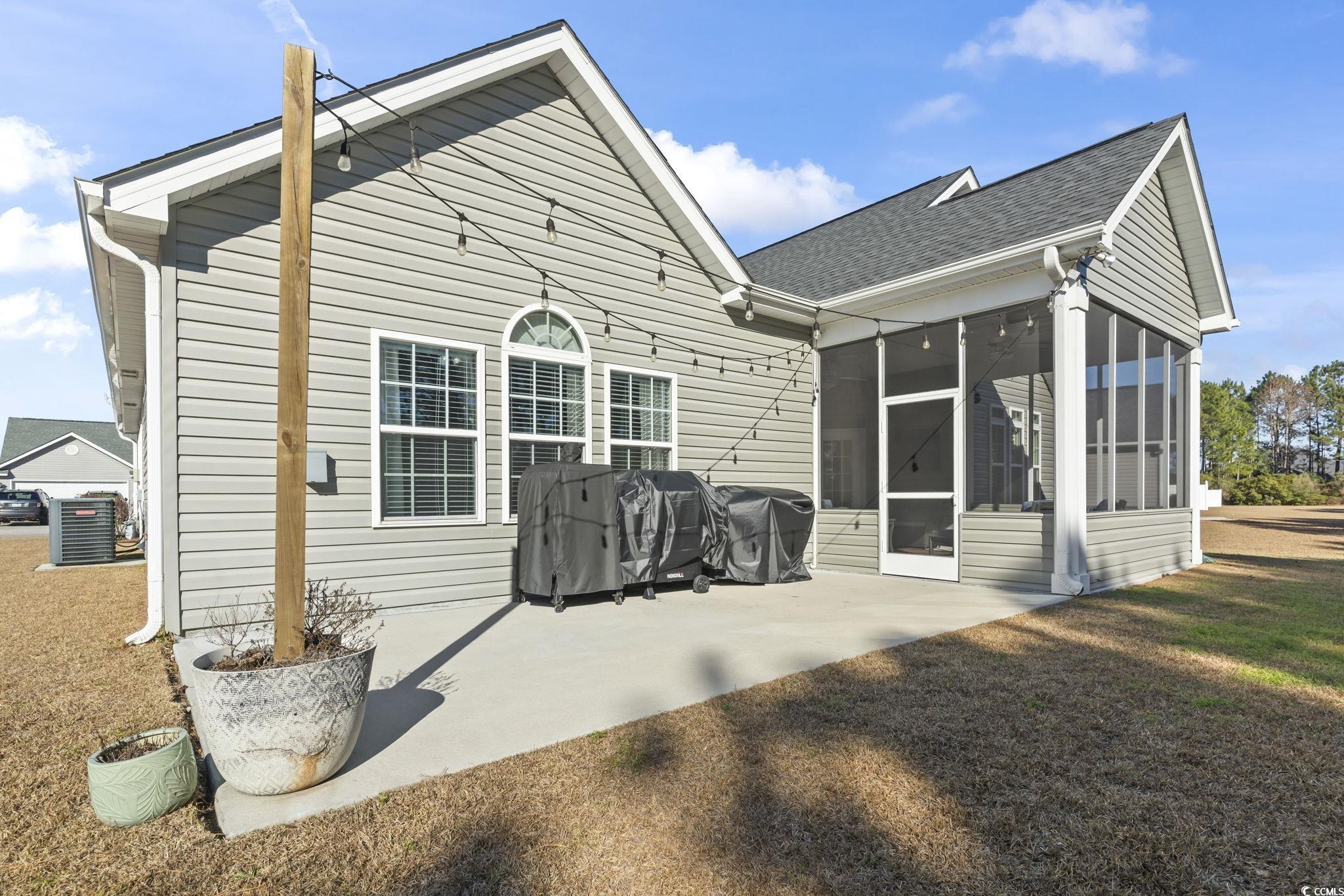 308 Turning Pines Loop Myrtle Beach, SC 29579 - Photo 32 of 33 Rear view of property featuring a sunroom, central