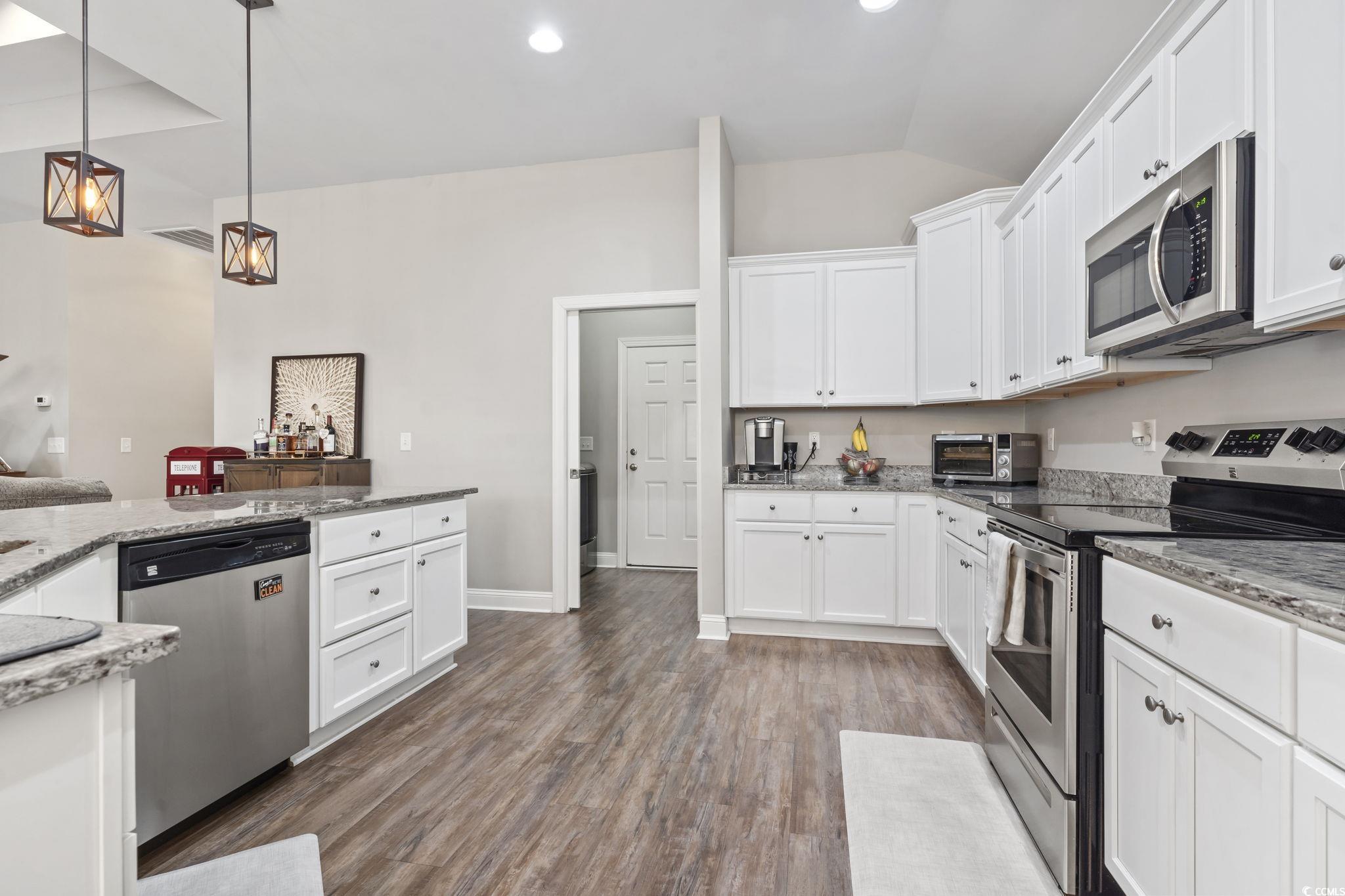 308 Turning Pines Loop Myrtle Beach, SC 29579 - Photo 5 of 33 Kitchen with pendant lighting, light stone counter