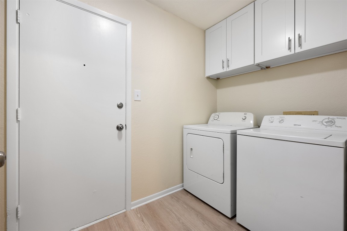 608 Country Aire Drive, Unit A Round Rock, TX 78664 - Photo 20 of 32 a view of storage and utility room with washer and dryer