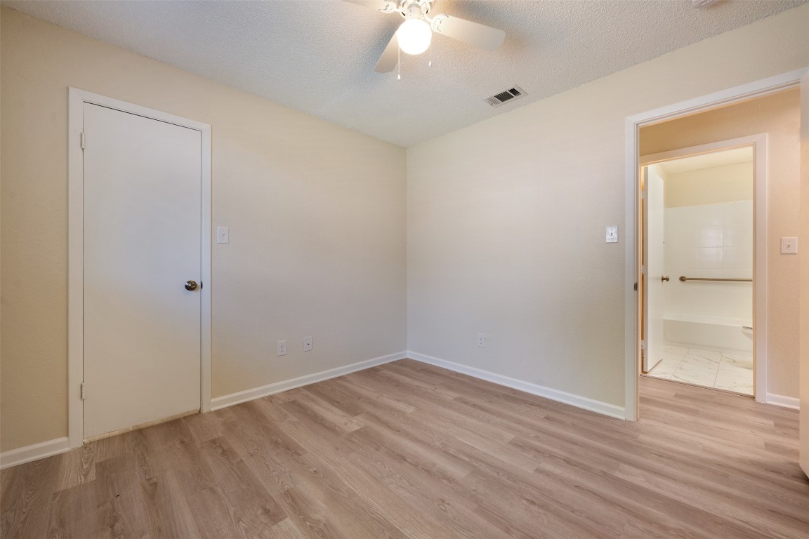608 Country Aire Drive, Unit A Round Rock, TX 78664 - Photo 23 of 32 wooden floor in an empty room