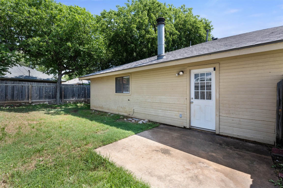 608 Country Aire Drive, Unit A Round Rock, TX 78664 - Photo 28 of 32 a view of a backyard with large tree