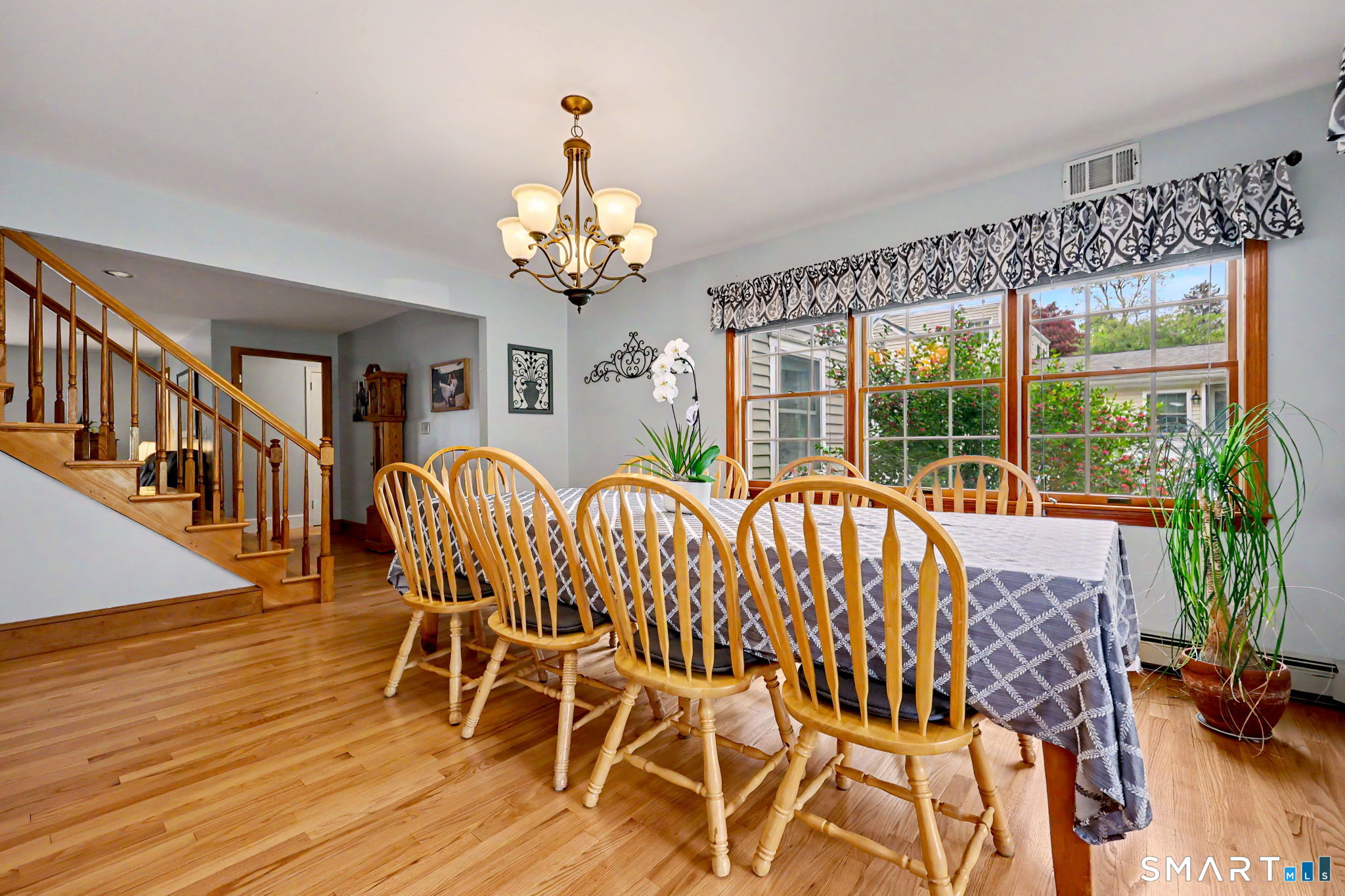 7 Merrill Road Trumbull, CT 06611 - Photo 11 of 40 a view of a dining room with furniture window and wooden floor