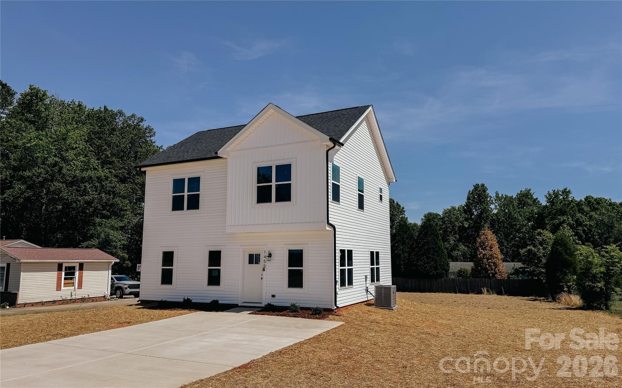 1455 West Ridge Road Salisbury, NC 28147 - Photo 3 of 26 a view of a white house with a yard