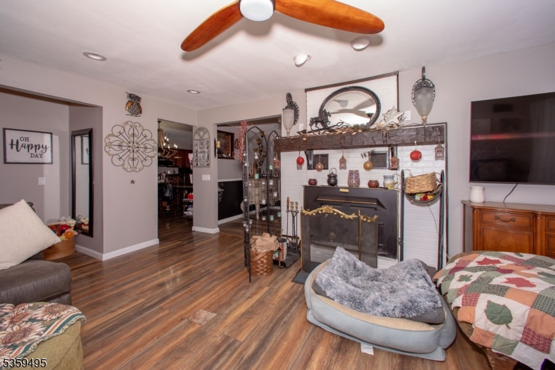 76 Glen Road Wantage, NJ 07461 - Photo 11 of 47 a living room with furniture and a fireplace