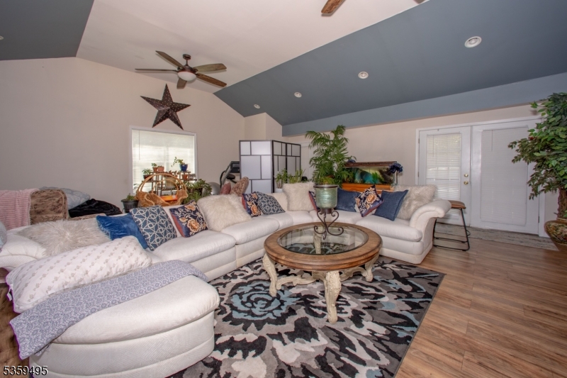 76 Glen Road Wantage, NJ 07461 - Photo 21 of 47 a living room with furniture and a wooden floor