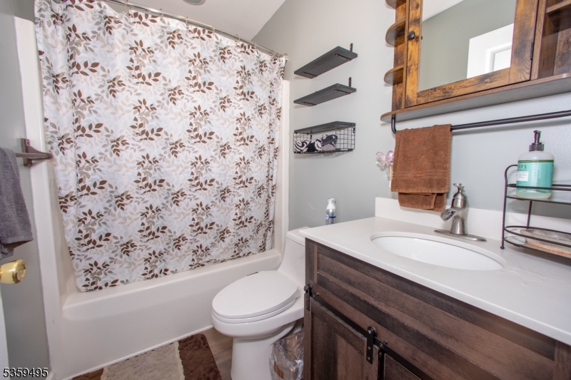76 Glen Road Wantage, NJ 07461 - Photo 26 of 47 a bathroom with a sink toilet and mirror