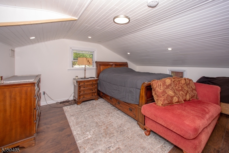 76 Glen Road Wantage, NJ 07461 - Photo 28 of 47 a living room with furniture and a rug