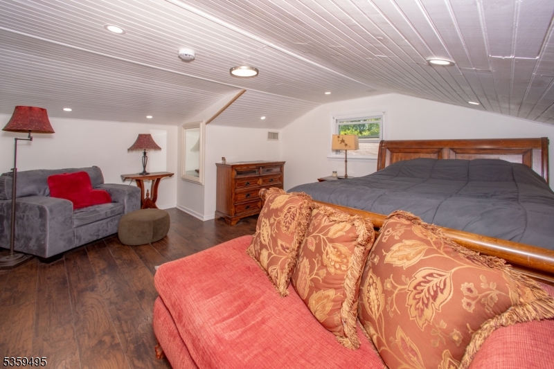 76 Glen Road Wantage, NJ 07461 - Photo 29 of 47 a bedroom with furniture and a wooden floor