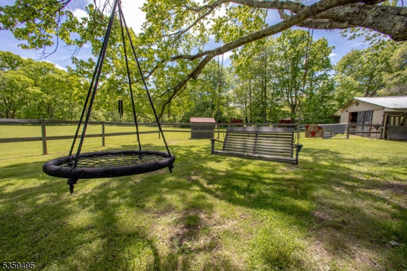 76 Glen Road Wantage, NJ 07461 - Photo 35 of 47 a view of a swimming pool with a bench