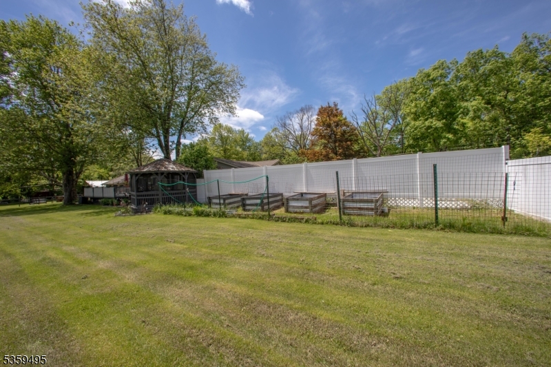 76 Glen Road Wantage, NJ 07461 - Photo 5 of 47 a view of a swimming pool with a yard