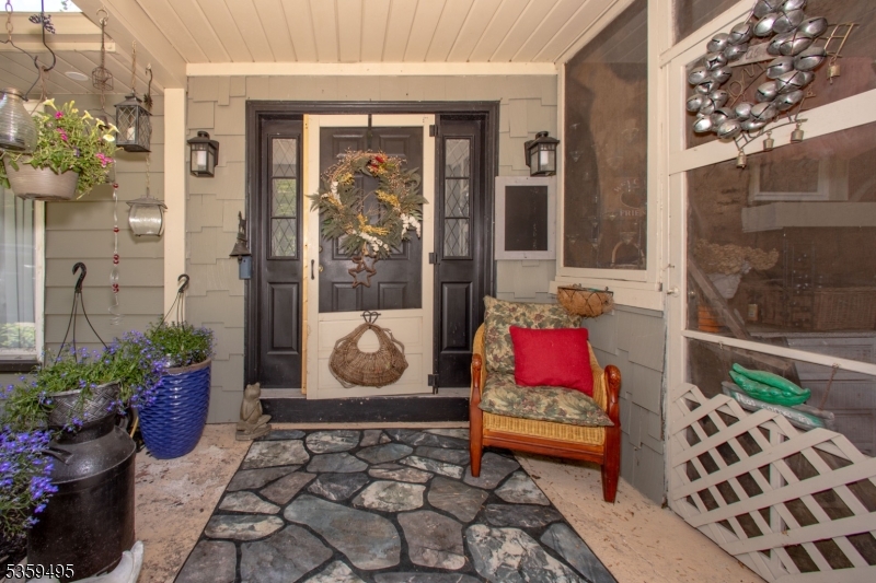 76 Glen Road Wantage, NJ 07461 - Photo 6 of 47 a balcony with couch and potted plant