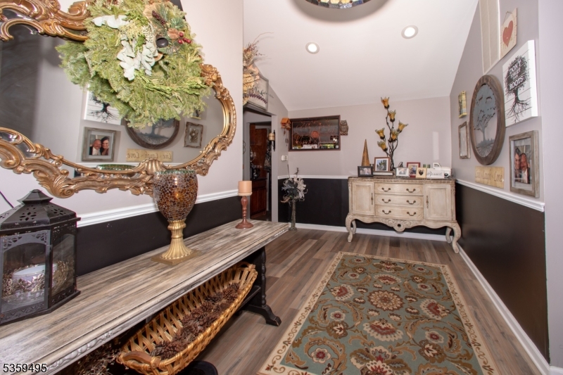 76 Glen Road Wantage, NJ 07461 - Photo 8 of 47 a living room with furniture and a fireplace