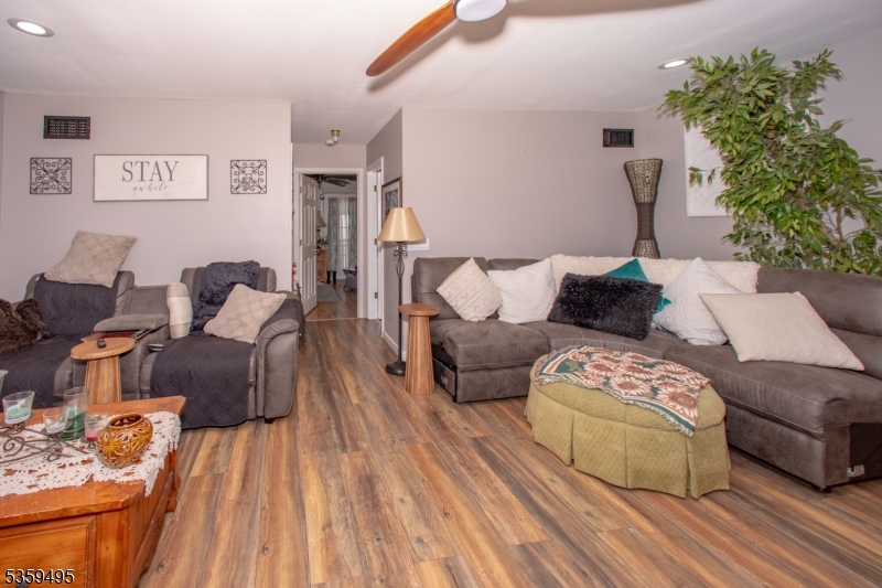 76 Glen Road Wantage, NJ 07461 - Photo 9 of 47 a living room with furniture and a couch