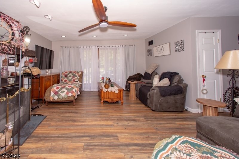 76 Glen Road Wantage, NJ 07461 - Photo 10 of 47 a bedroom with furniture and a flat screen tv