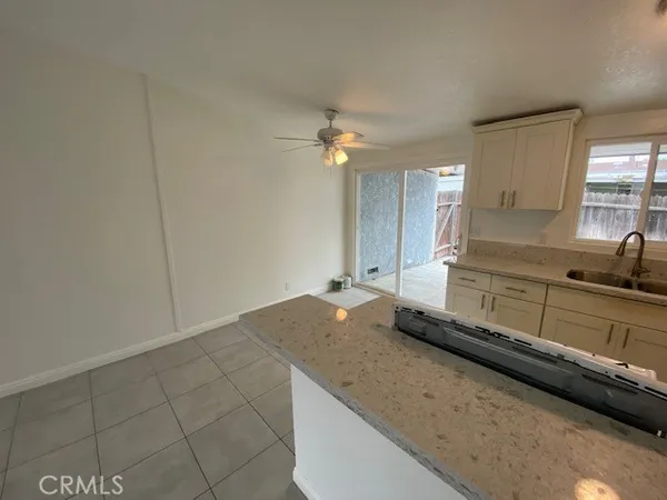 a kitchen with a sink cabinets and window