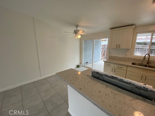 2214 Rutgers Drive Costa Mesa, CA 92627 - Photo 3 of 25 a kitchen with a sink cabinets and window
