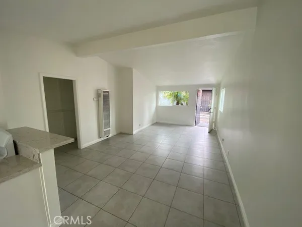 a view of an empty room with windows