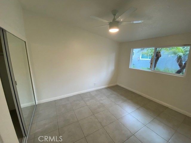 an empty room with windows and entrance