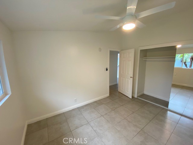 2214 Rutgers Drive Costa Mesa, CA 92627 - Photo 8 of 25 an empty room with a bathroom and chandelier fan