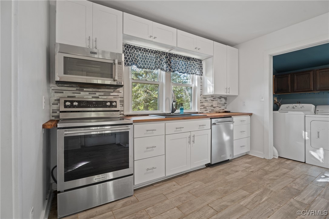 6405 King William Road Aylett, VA 23009 - Photo 12 of 40 Kitchen with white cabinets, stainless steel appli