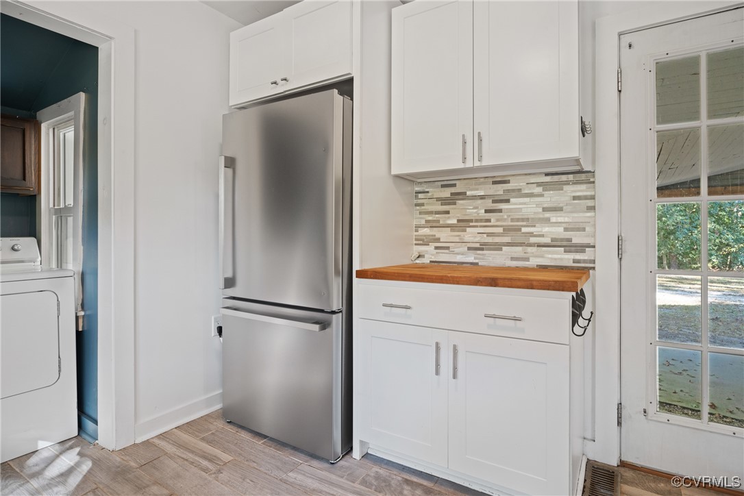 6405 King William Road Aylett, VA 23009 - Photo 15 of 40 Kitchen with stainless steel fridge, light hardwoo